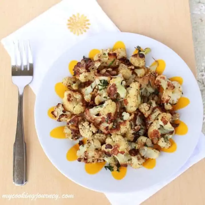 Oven Roasted Cauliflower in a plate - Featured Image.