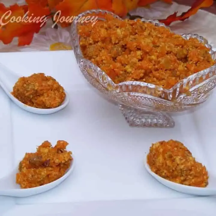 Gajar Ka Halwa in a bowl and spoon on a white plate - Featured Image.