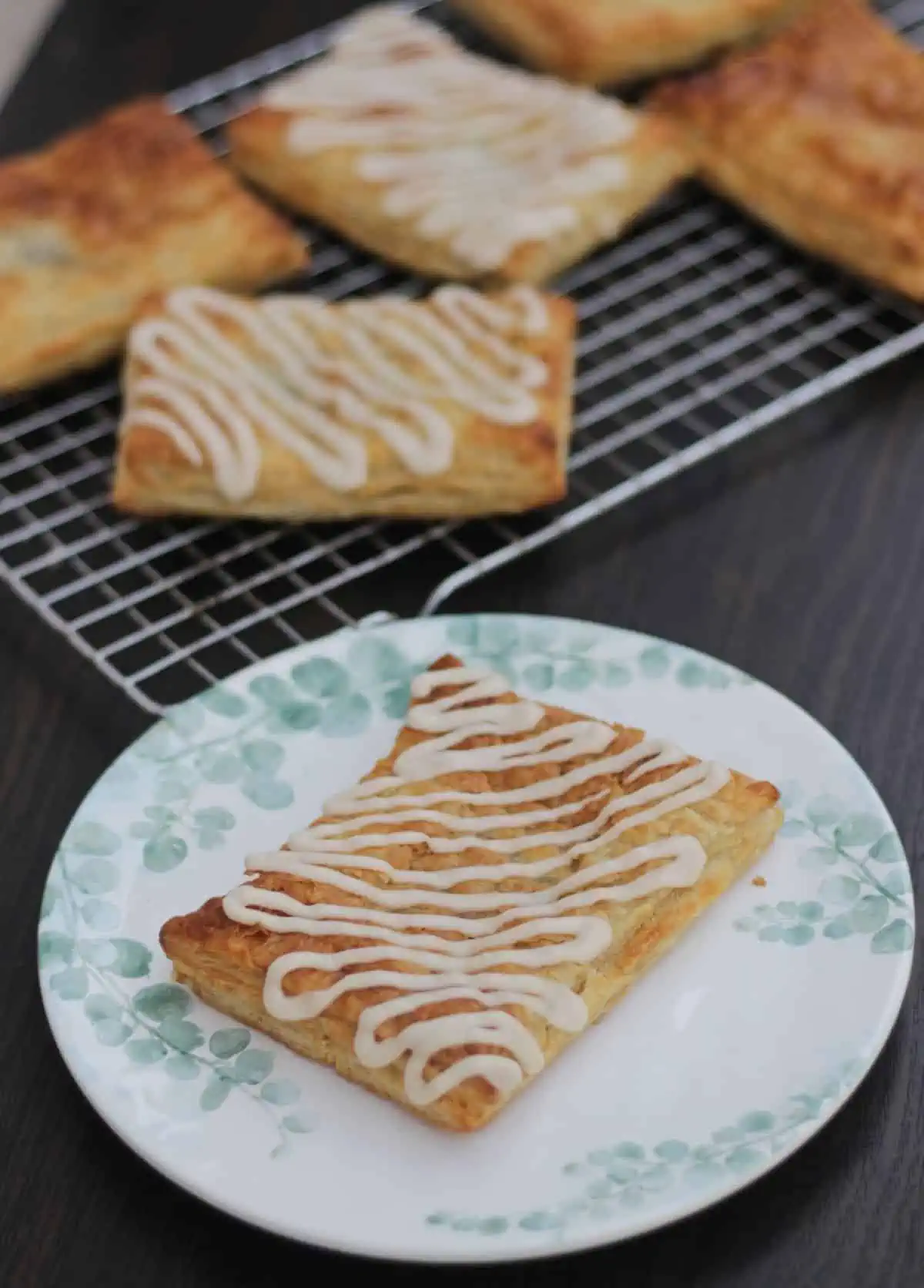 one toaster strudel in a plate and few more in a rack.